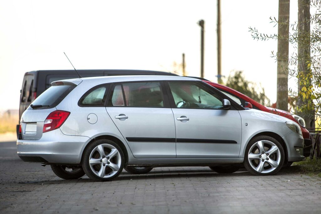 side-view-of-silver-shiny-luxurious-car-parked-on-2022-09-12-17-36-39-utc.jpg